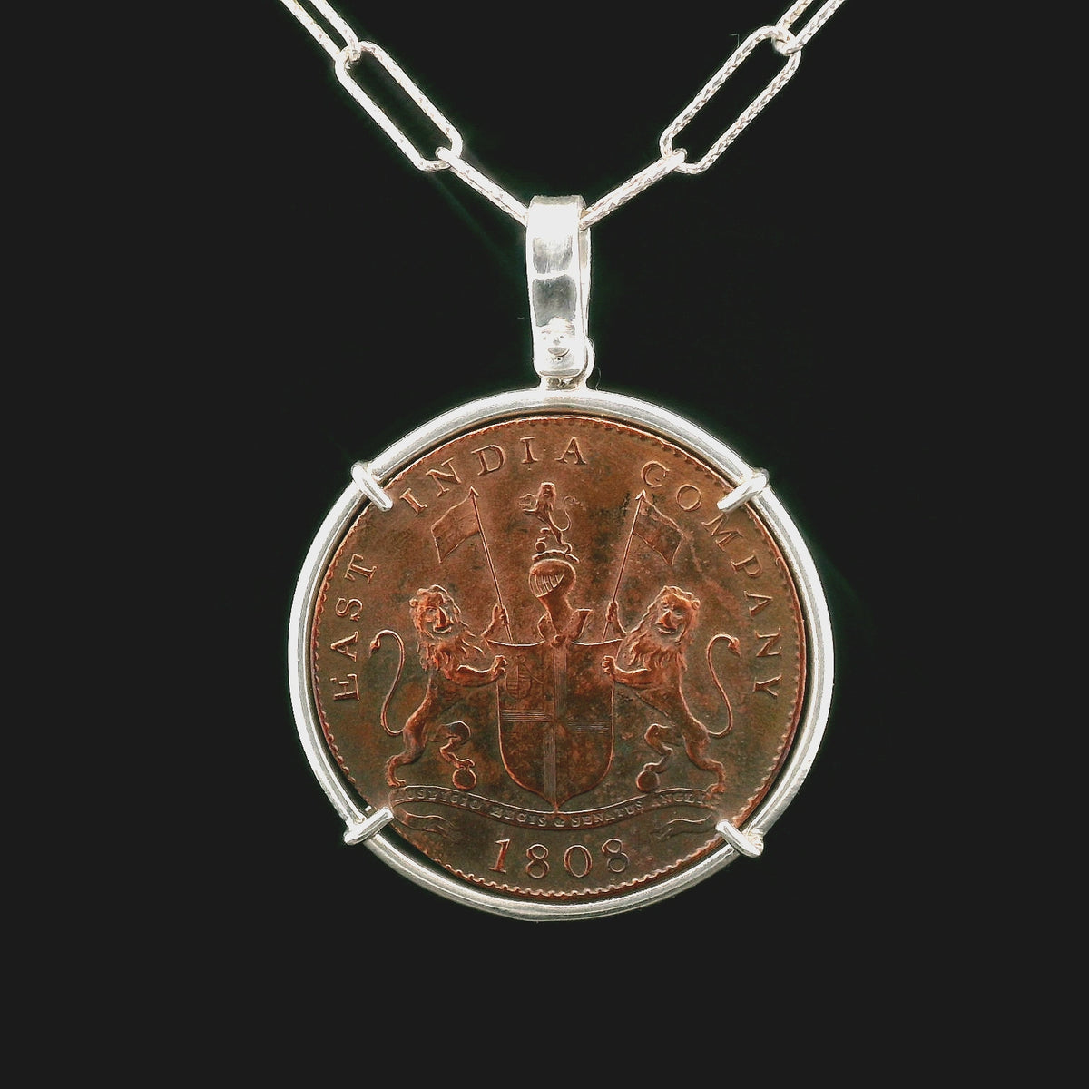 Rotating Shipwreck Copper coin pendant set in sterling silver.