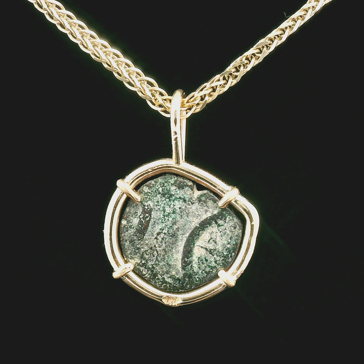 Rotating Bronze Widow’s Mite coin pendant set in 14K gold.