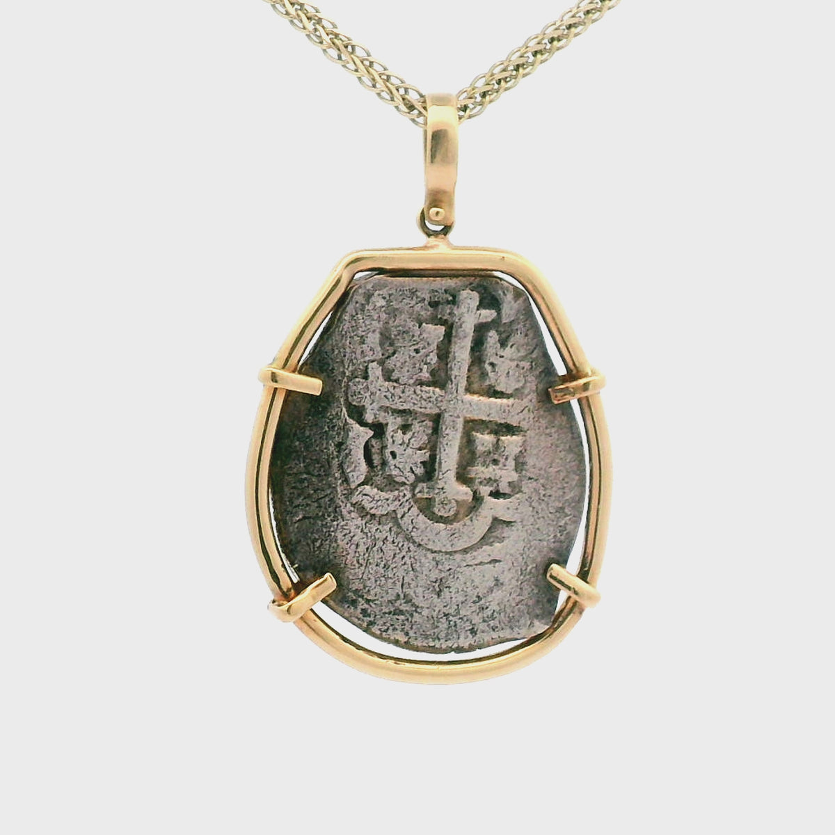 Rotating Silver Piece of 8 coin pendant set in 14K gold.