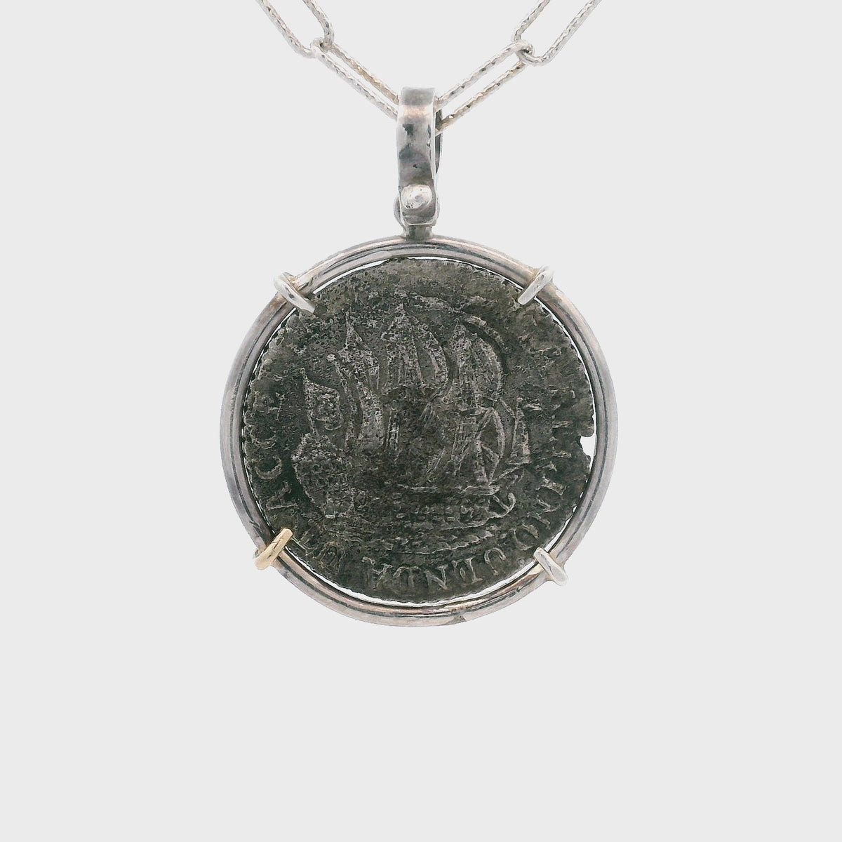 Rotating Silver Dutch coin pendant set in silver.