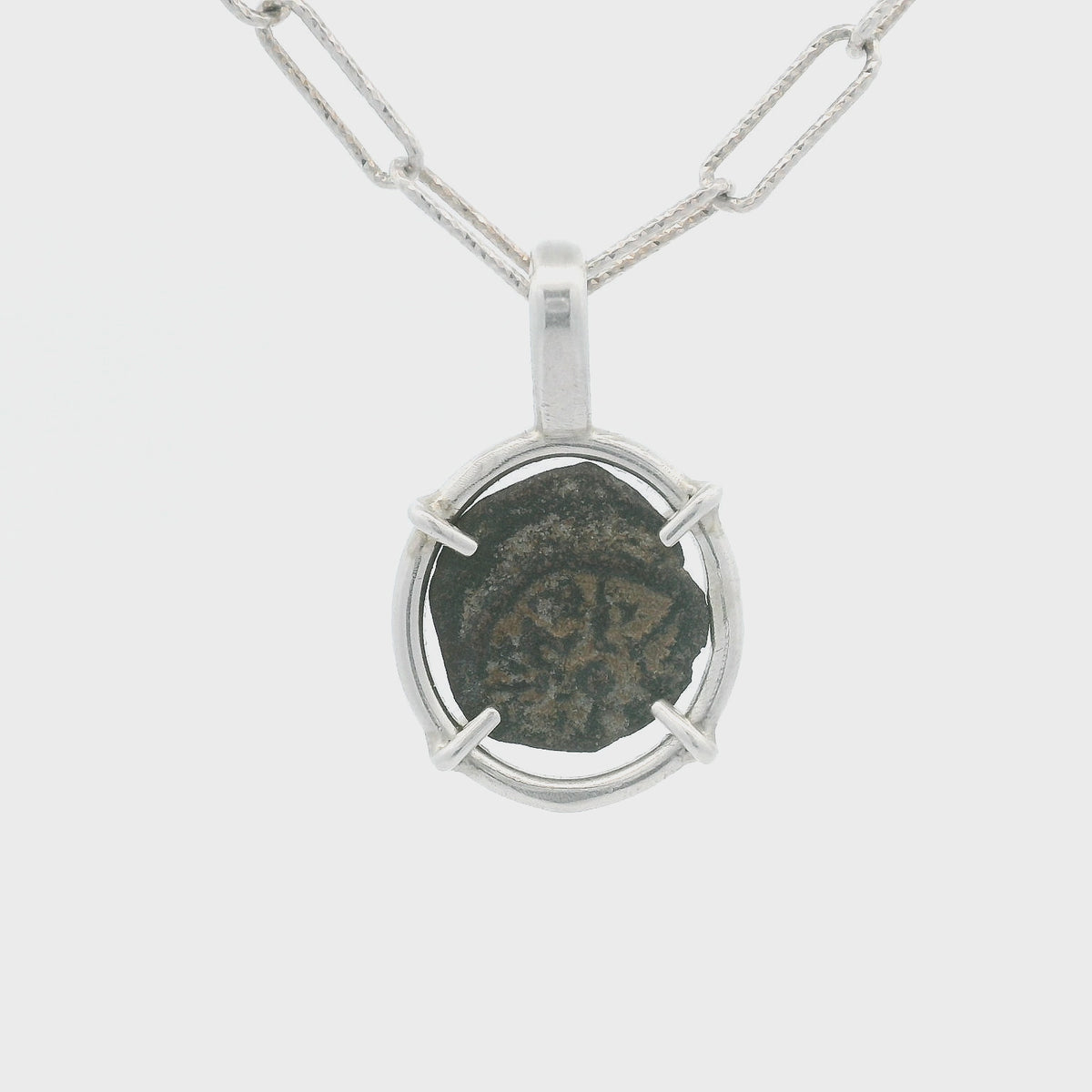 Rotating Bronze Widow’s Mite coin pendant set in sterling silver.