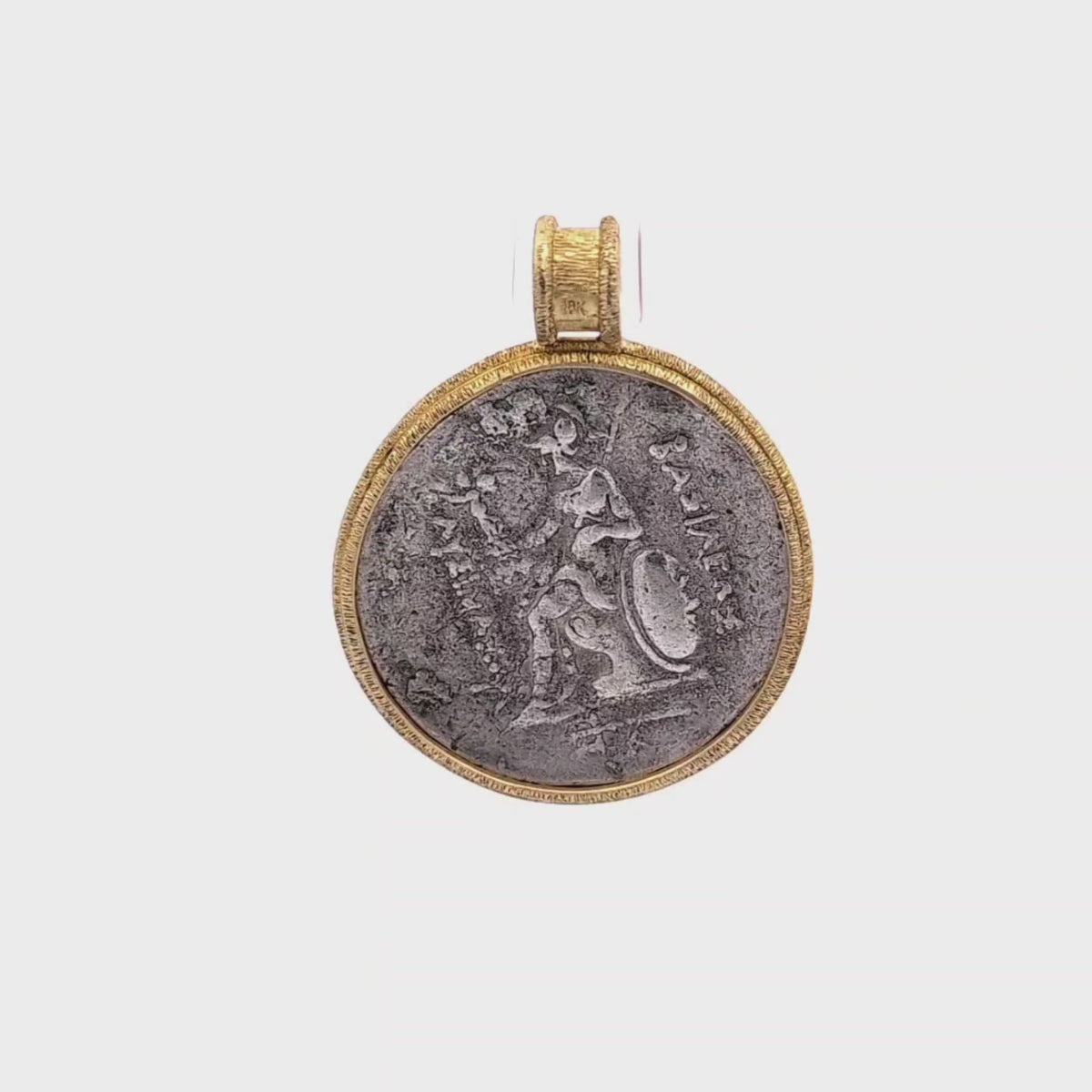 Rotating Silver Ancient Greek coin pendant set in 18K gold.