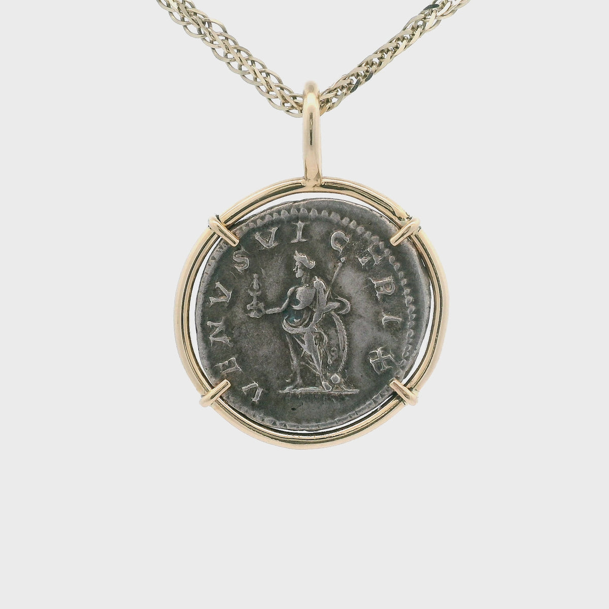 Rotating Silver Ancient Roman coin pendant set in 14K gold.